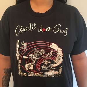 Rock t-shirt: Charlie Don’t Surf